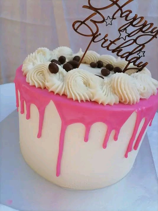 Pink drip birthday cake